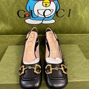 Gucci Black Heeled Boots with Gold Accents